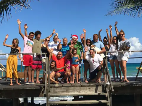 Group of guests waving from the ocean deck