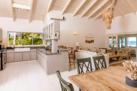 Open plan kitchen and dining area with high ceilings