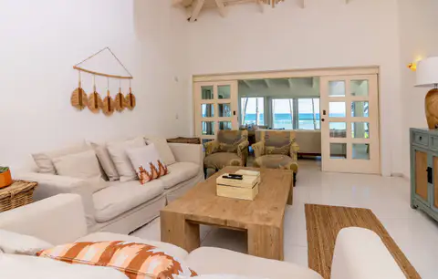 Villa living room with cream sofas and a wooden coffee table