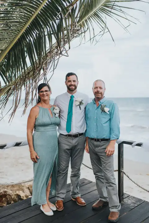 Three guests posing on the ocean deck