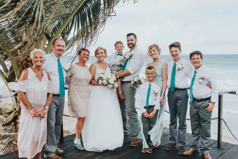 Wedding party and family posing together on the deck