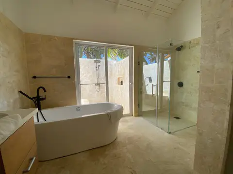Bathroom with a freestanding bath and glass shower