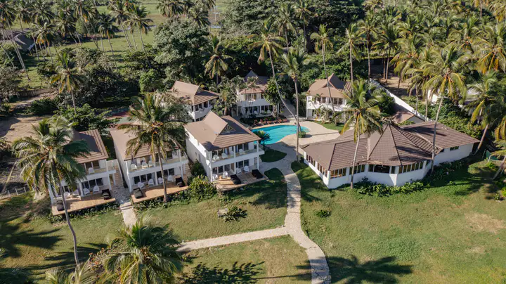 Aerial view of Las Canas Beach Retreat, its two pools and the beachfront gardens