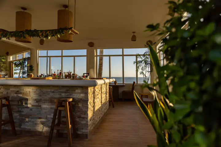 Restaurant bar and meeting tables beside the ocean
